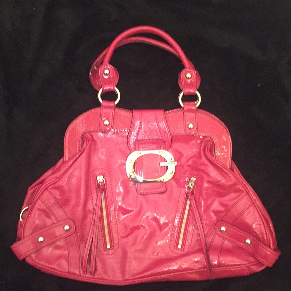 Magenta colored patent leather shoulder bag